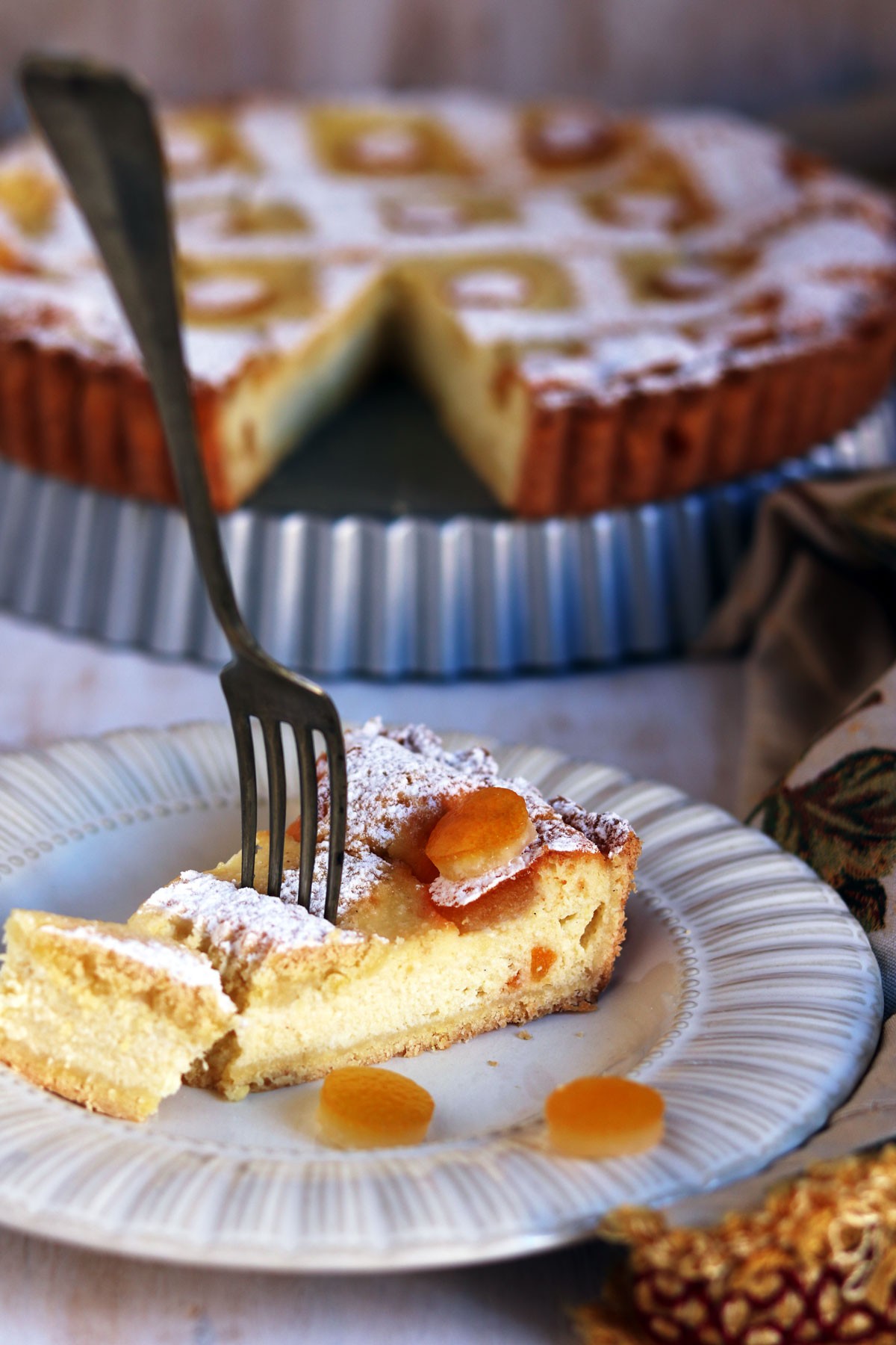 Crostata di ricotta e pinoli profumata all’arancia